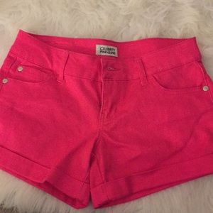 Pink shorts.